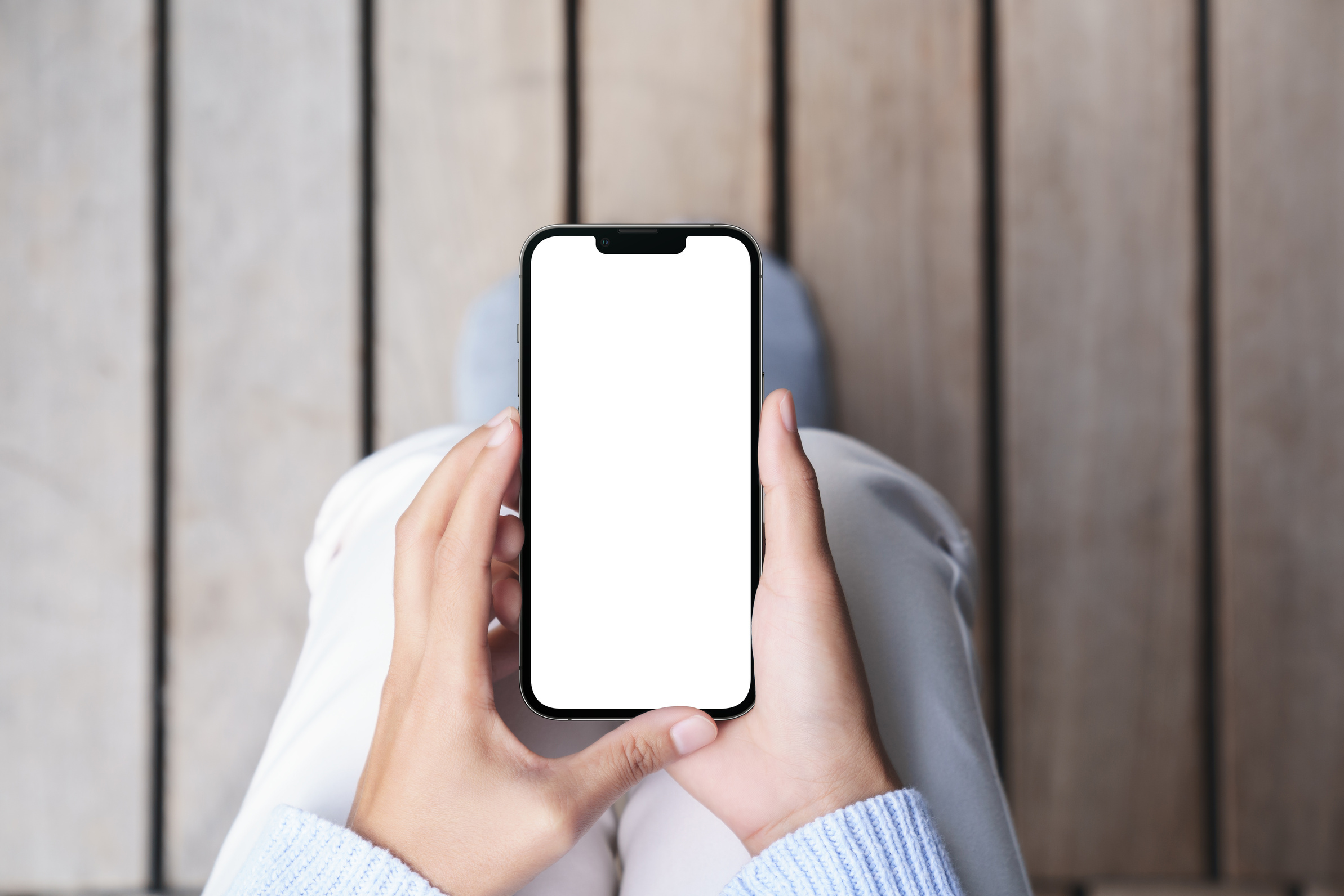 hand using mock-up phone mobile on top angle view