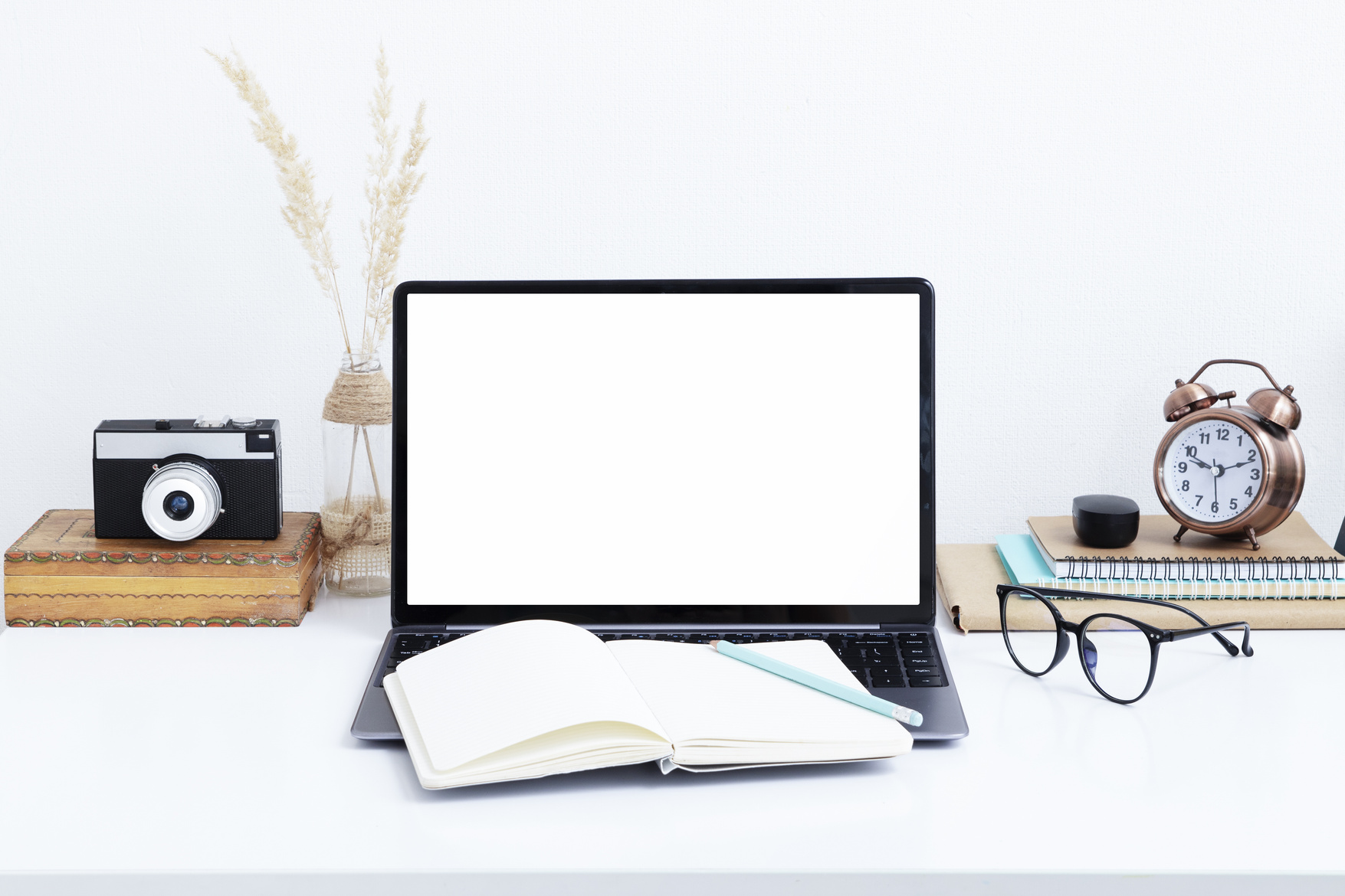 Blank laptop screen mockup, vintage camera and glasses. Work